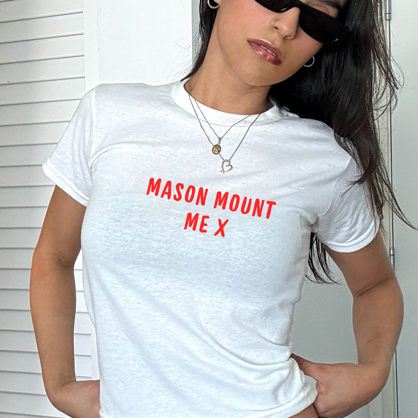 White fitted baby tee with red “Mason Mount Me X” slogan, styled casually with a shoulder bag, perfect for England football fans and match day outfits