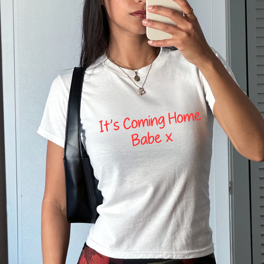 White baby tee with red “It’s Coming Home Babe x” slogan, England football fan shirt